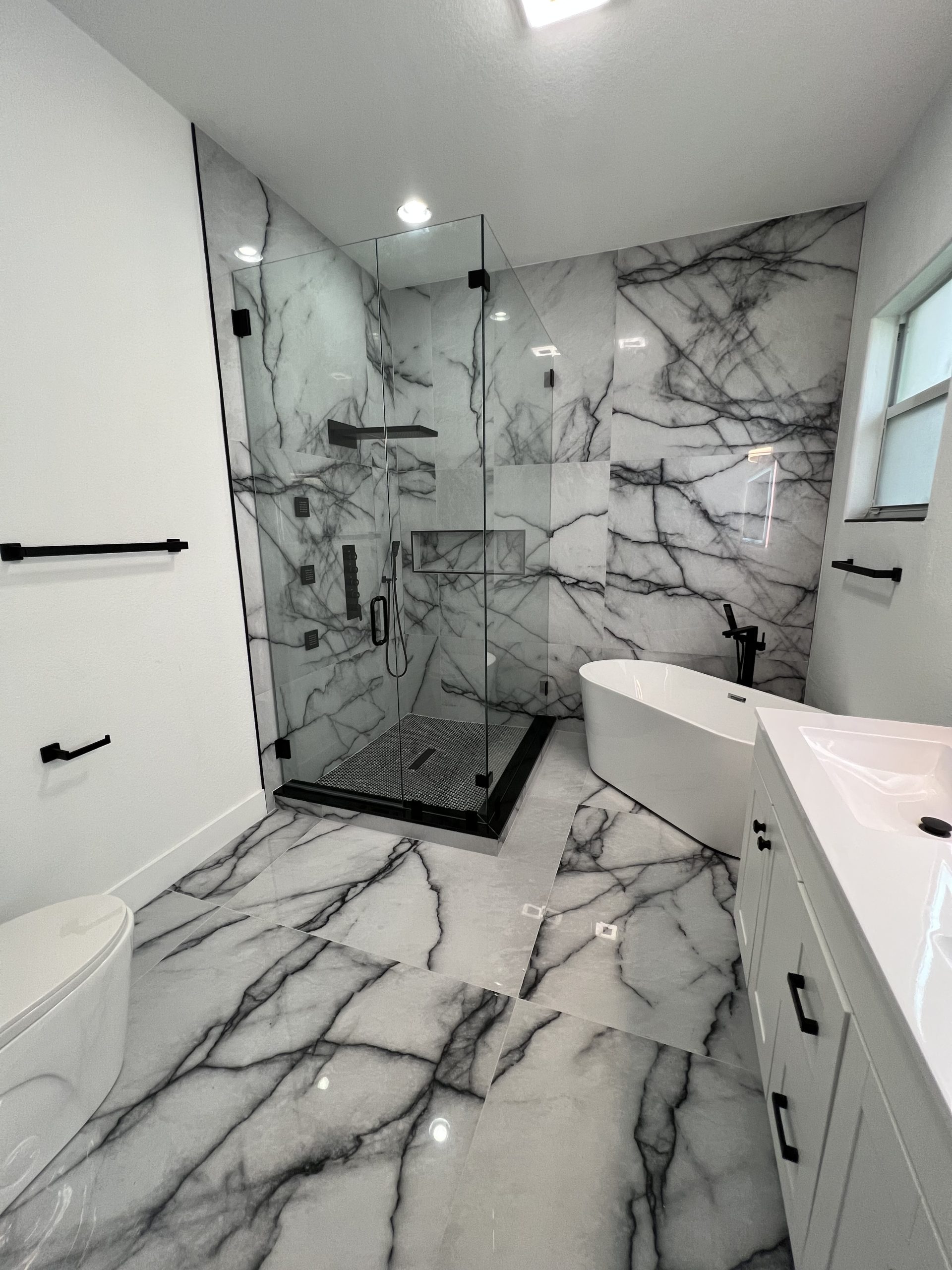 Arched marble niche hallway bathroom