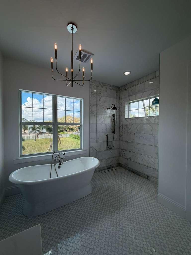 Custom frameless glass shower enclosure